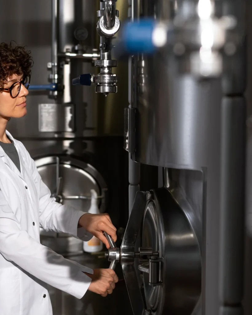 medium-shot-woman-working-beer-factory (1)