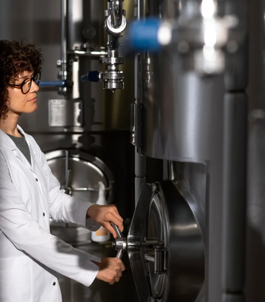 medium-shot-woman-working-beer-factory (1)